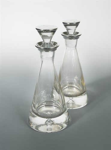Lot 438 - A pair of 20th century silver topped glass 'pyramid' decanters