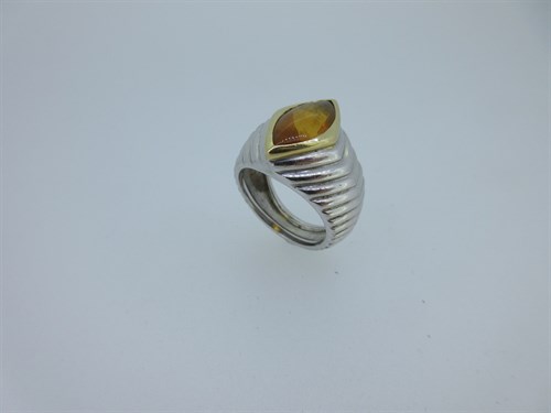Lot 55 - A French platinum and 18ct gold ring set with a citrine