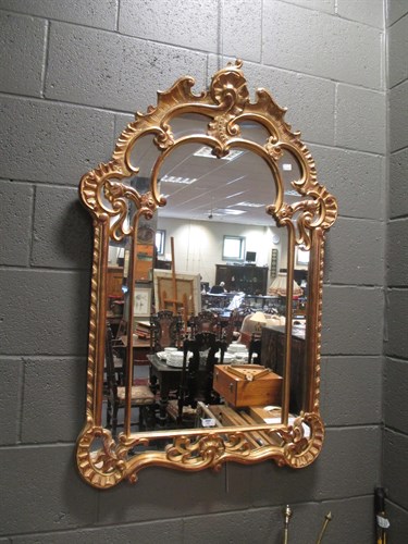 Lot 446 - A George III style gilt framed wall mirror...