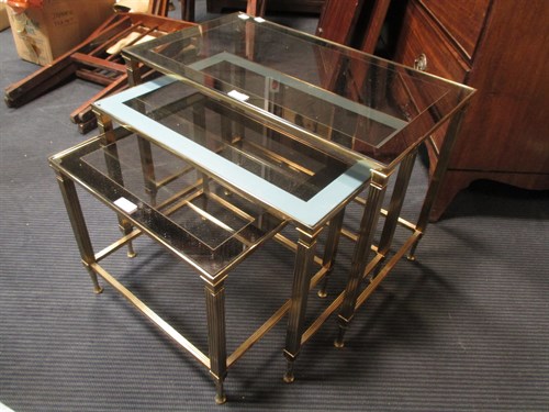 Lot 424 - Three graduated brass framed occasional tables...