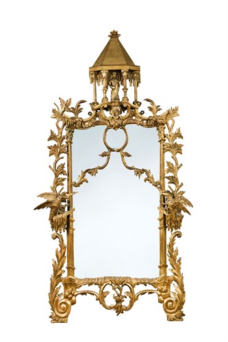 Lot 582 - A Rococo revival gilt wood framed pier glass