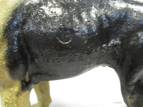 Lot 114 - A cast iron pug dog approx 24.5cm high