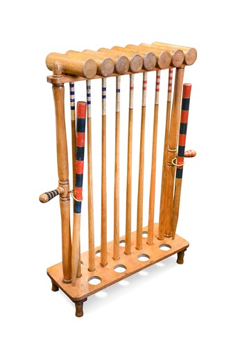 Lot 698 - An ash Croquet stand of 8 mallets and 8 balls