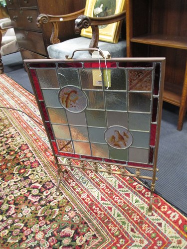 Lot 417 - A Victorian brass framed fire screen inset...