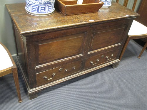 Lot 441 - An 18th century oak mule chest with panelled...