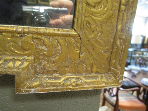 Lot 495 - A small gilt framed wall mirror H59cm W41cm