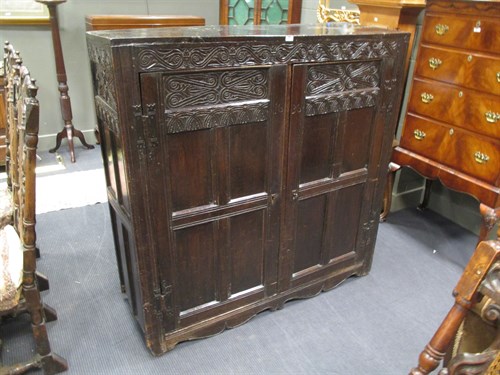 Lot 493 - A 17th century oak wainscote cupboard, with...