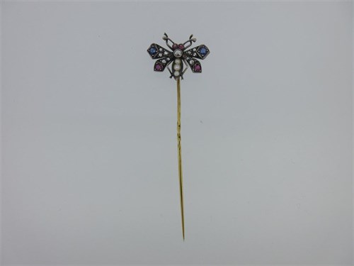 Lot 208 - An antique diamond and gem set butterfly stick pin