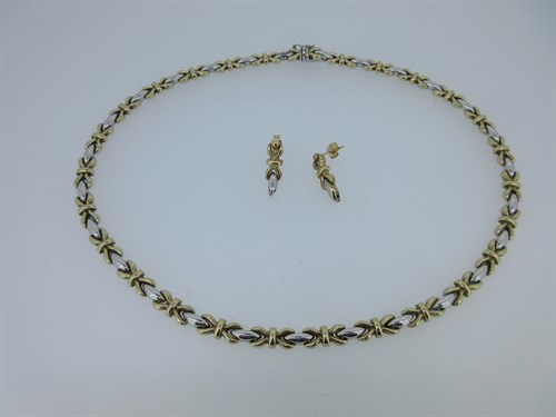 Lot 141 - A bi-coloured fancy link necklace and earring suite stamped '375'