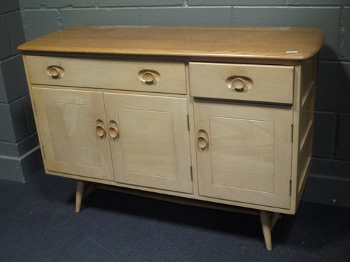 Lot 404 - An Ercol elm sideboard, faded, 83 x 123 x 46cm