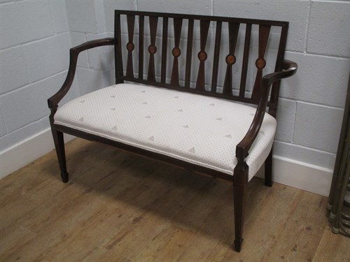 Lot 502 - An Edwardian mahogany two-seater settee...