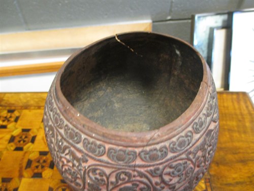 Lot 244 - A carved coconut shell on stand