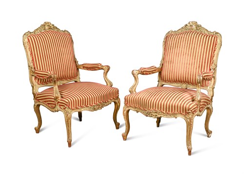 Lot 654 - A pair of Louis XV revival carved giltwood framed armchairs