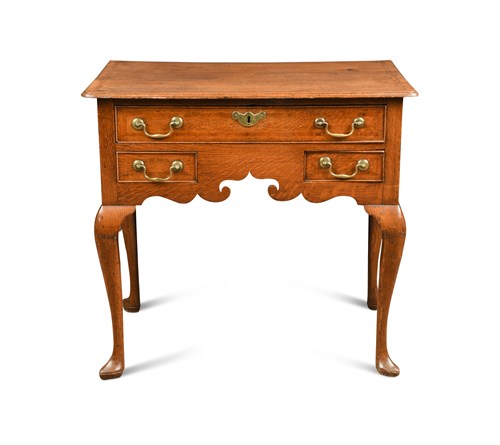 Lot 547 - An 18th century oak lowboy