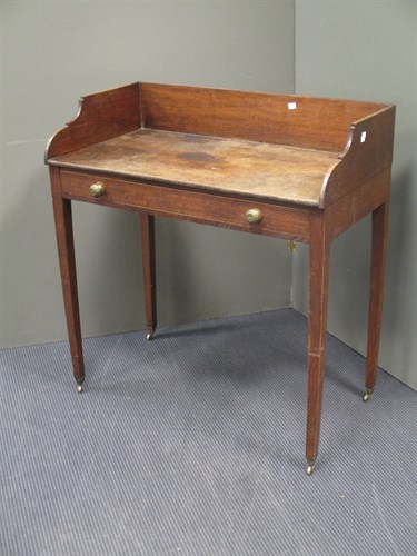 Lot 470 - A Regency oak wash stand on square tapering...
