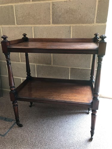 Lot 440 - A William IV mahogany two tier book trolley on...