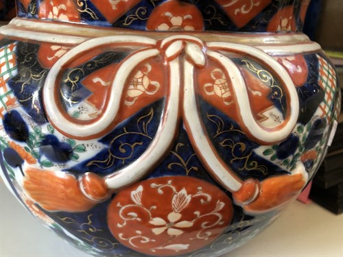 Lot 455 - A pair of porcelain imari palette circular jardinieres, circa 1900