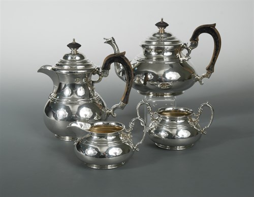 Lot 410 - A George V silver four piece tea set