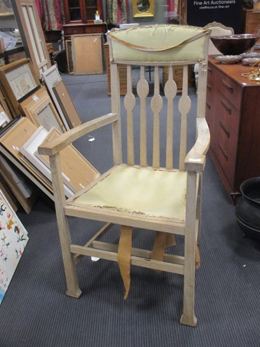 Lot 515 - A bleached oak armchair in the manner of Voysey