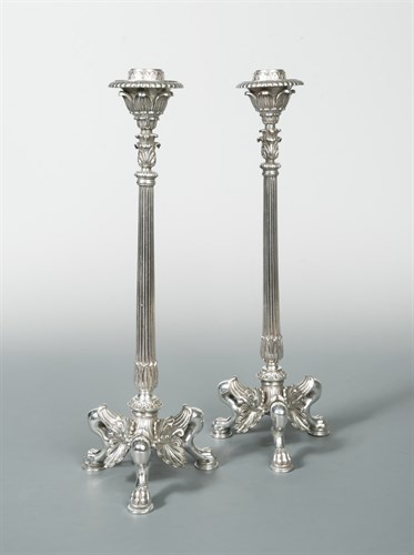 Lot 286 - A pair of Victorian silver plated cast column candlesticks