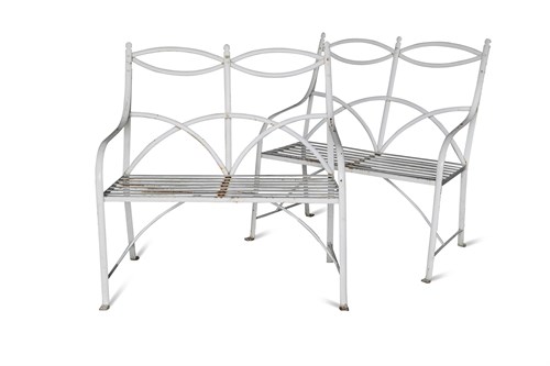 Lot 686 - A pair of Regency style painted iron strapwork garden seats, (2)