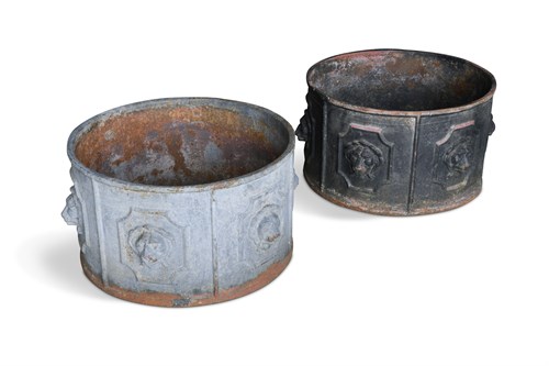 Lot 691 - A pair of cast iron circular planters