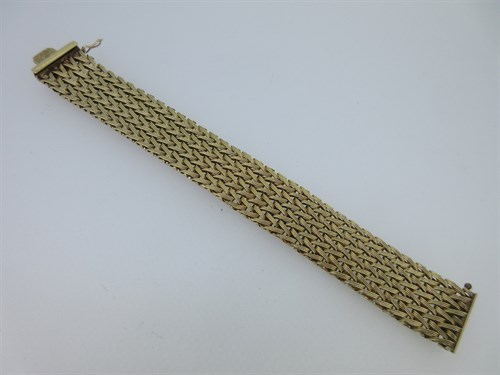 Lot 197 - A 9ct gold woven cuff bracelet