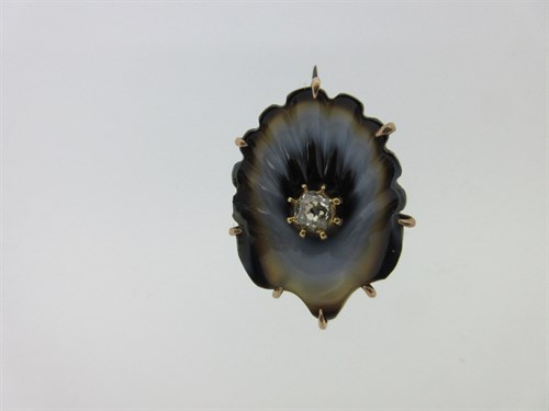 Lot 175 - A 19th century carved agate and diamond shell brooch
