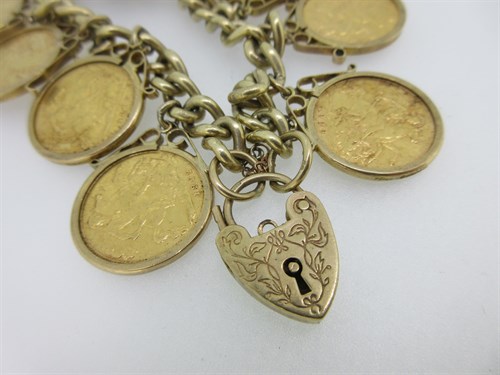 Lot 45 - A 9ct gold charm bracelet with ten half sovereigns
