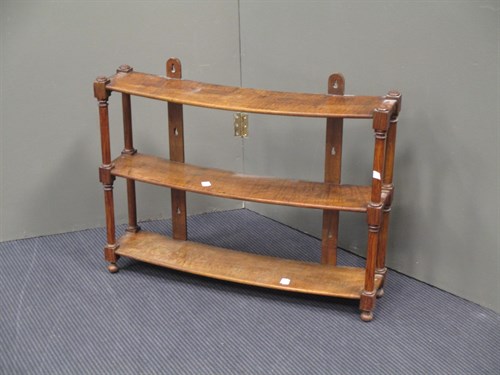 Lot 452 - A set of two-tier walnut hanging shelves...