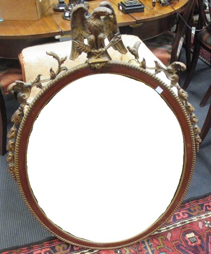 Lot 419 - A mahogany and parcel gilt oval wall mirror,...