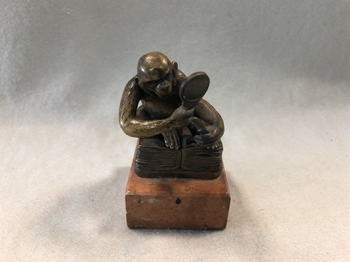Lot 432 - A small Bergman bronze model of a monkey or ape with a comb and a hand mirror