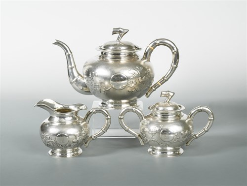 Lot 309 - A late 19th/early 20th century Chinese export metalwares three piece tea set