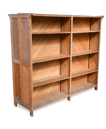 Lot 228 - A late 19th century oak double sided bookcase