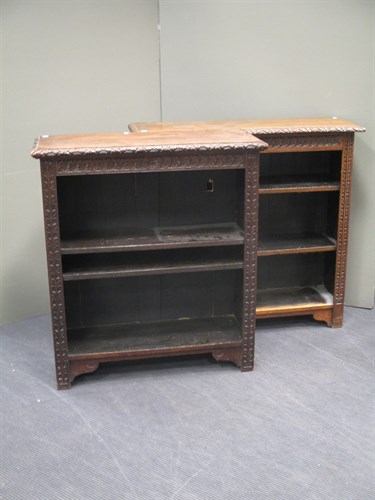 Lot 463 - A near pair of oak bookcases with carved...