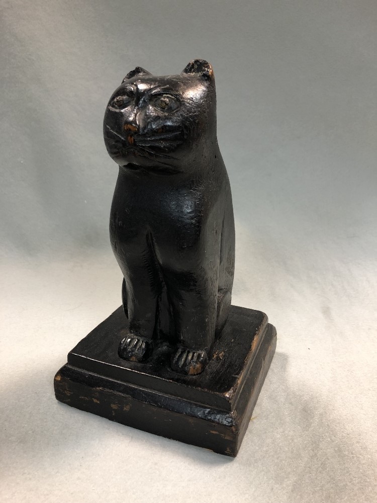 Lot 398 - A 19th century carved wooden folk art cat, possibly Welsh