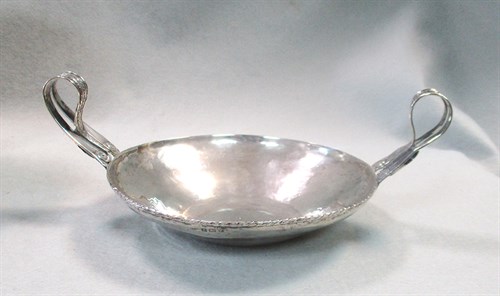 Lot 166 - An Arts & Crafts style silver two handled dish