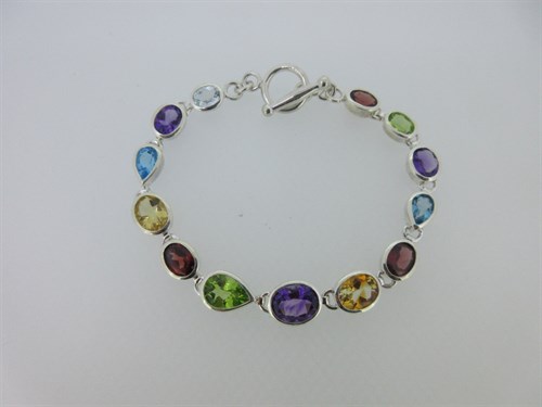 Lot 18 - A modern multi gem set bracelet