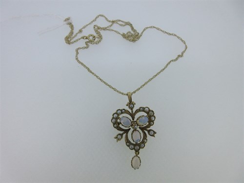 Lot 101 - An opal and seed pearl pendant / brooch set in 9ct gold with gold chain