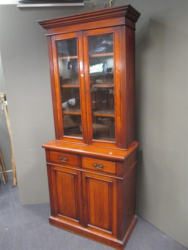 Lot 437 - A late Victorian walnut glazed top bookcase,...