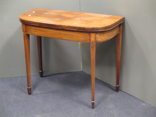 Lot 480 - A George III mahogany foldover top table
