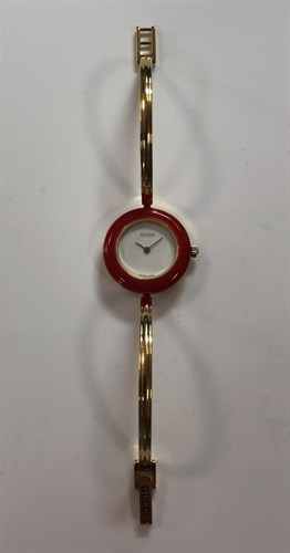 Lot 270 - Gucci - A lady's gold plated bangle watch