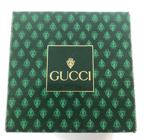 Lot 270 - Gucci - A lady's gold plated bangle watch
