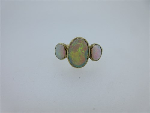 Lot 100 - A modern opal three stone ring