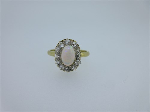 Lot 36 - An opal and diamond cluster ring