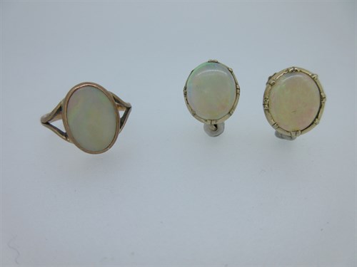Lot 93 - An opal ring together with a pair of opal earrings