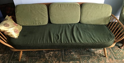 Lot 507 - An Ercol stick back settee, 207cm wide