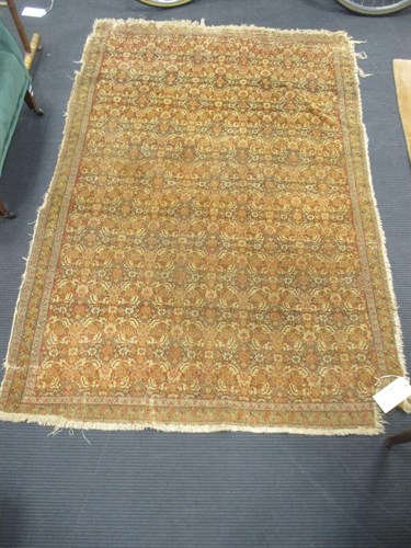 Lot 528 - A worn and damaged Kashan type rug, 190 x 130cm