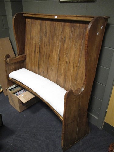Lot 570 - A 19th century provincial wood planked settle...