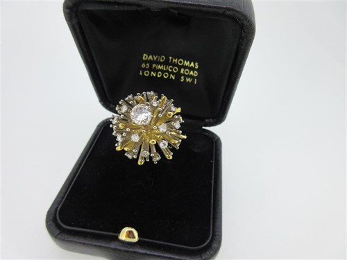 Lot 219 - David Thomas - a diamond set sunburst ring